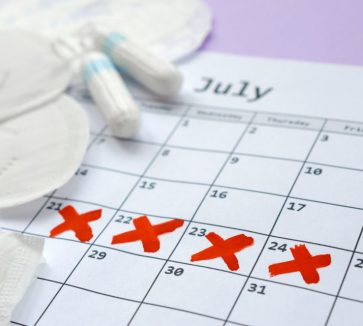 Aspects of women wellness in monthlies period. Menstrual pads and tampons on menstruation period calendar. Woman critical days, gynecological menstruation cycle period. Sanitary woman hygiene